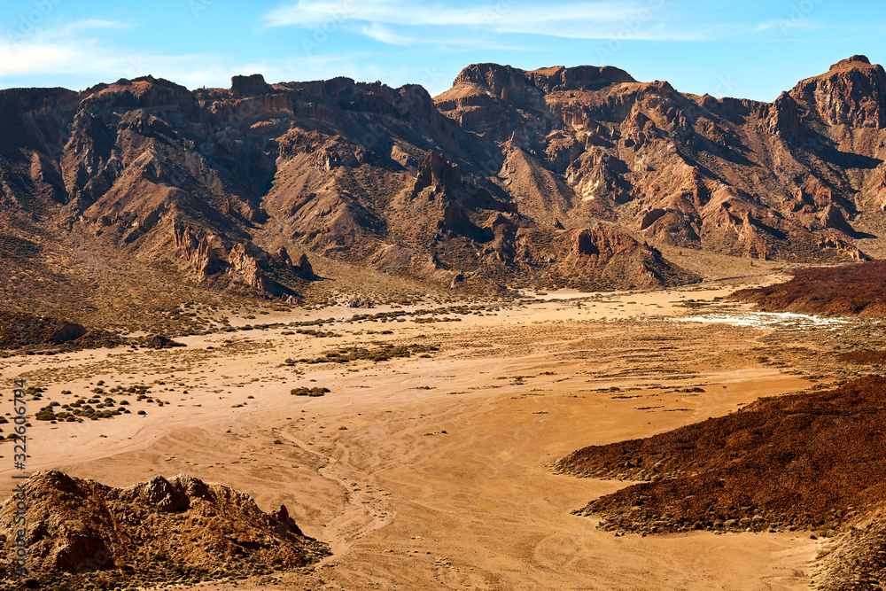 Fototapeta premium Beautiful aerial view of the canyon, mountains and volcano teide in tenerife national park on a summer sunny day. Canary islands