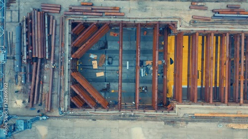 Aerial top down view of the low-depth underground railway station under construction (in a course of building) photo