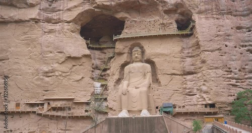 Ancient Chinese Buddha Statue at Bingling Cave Temple in Gansu China. UNESCO World heritage site photo