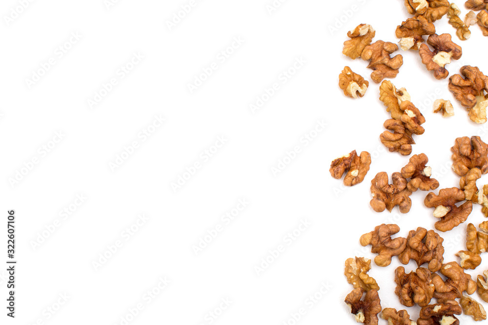 peeled walnuts on a white background with copy space for writing