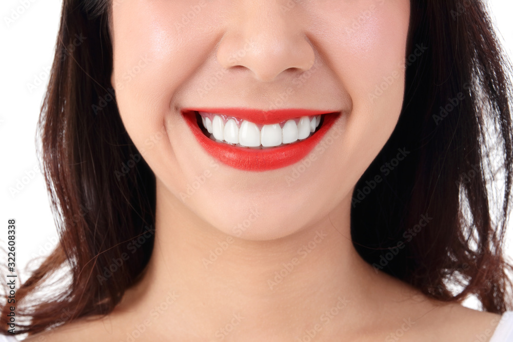 Asian women have beautiful smiles, clean white teeth, red lips, white background. Dental care concepts Asian women have beautiful smiles, clean white teeth, red lips, white background. Dental care concepts