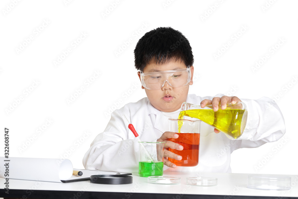 Elementary school boys wear white clothes, doing science experiments in the laboratory. Concept of child education development. isolated Elementary school boys wear white clothes, doing science experiments in the laboratory. Concept of child education development. isolated