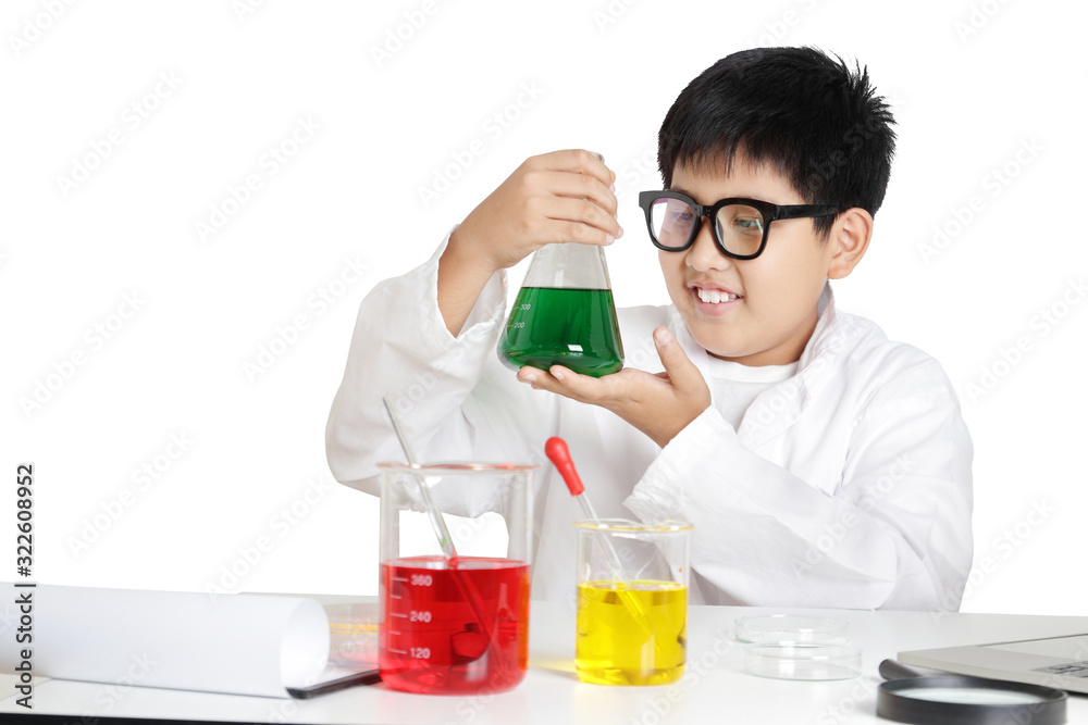 Elementary school boys wear white clothes, doing science experiments in the laboratory. Concept of child education development. isolated Elementary school boys wear white clothes, doing science experiments in the laboratory. Concept of child education development. isolated