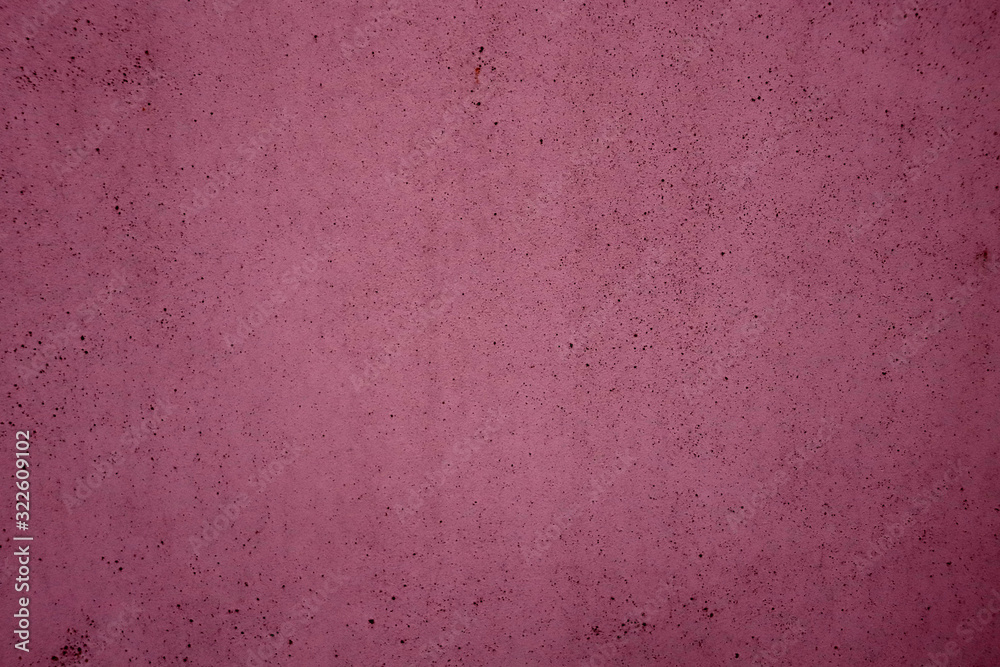 Background of a purple porous surface. The texture of the purple surface. Purple color surface for design Background of a purple porous surface. The texture of the purple surface. Purple color surface for design