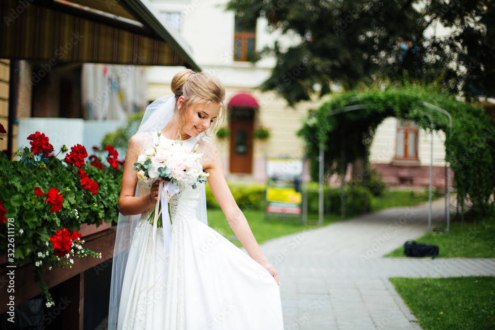 The beautiful bride smiling outdoors The beautiful bride smiling outdoors