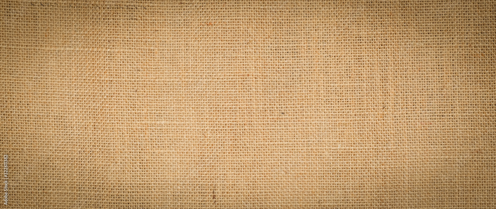 Hessian sackcloth burlap woven texture background / cotton woven fabric background with flecks of varying colors of beige and brown. with copy space. office desk concept. Hessian sackcloth burlap woven texture background / cotton woven fabric background with flecks of varying colors of beige and brown. with copy space. office desk concept.
