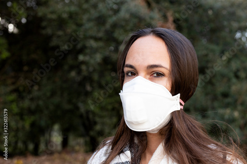 Girl with medical face mask against virus