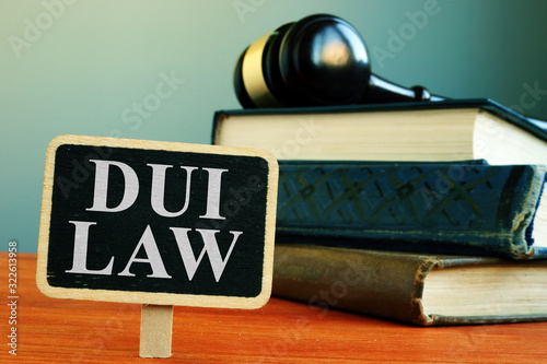 DUI law driving under the influence sign and books.
