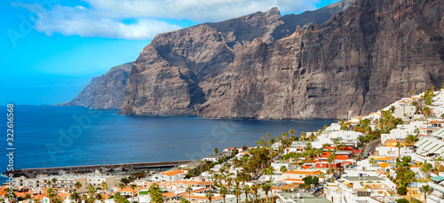 Tenerife island on a summer day panoramic landscape. Amazing aerial view on ocean and rocks. Seaside resort. © EvgL