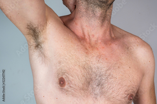 shirtless caucasian man with chest hair and armpit