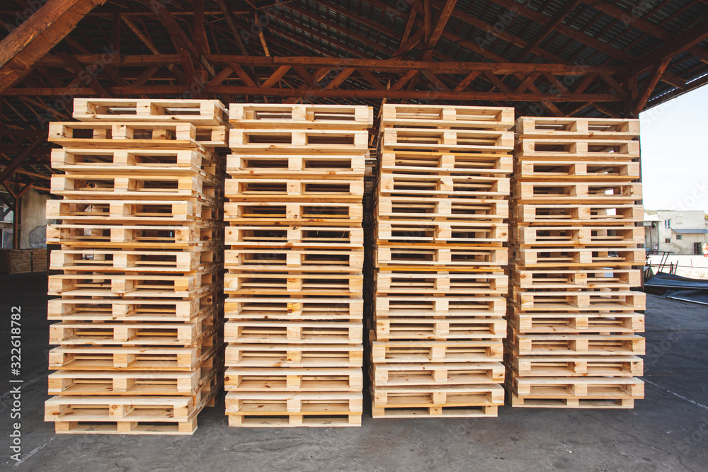 Warehouse with many pallets ready for use Warehouse with many pallets ready for use