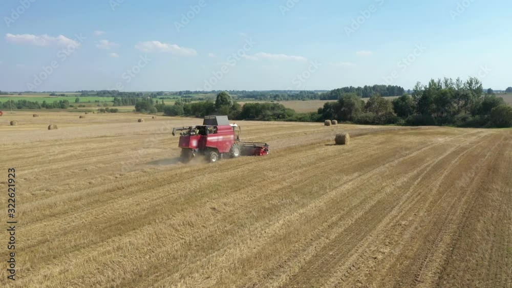 Agricultural Combine Harvester Of Ripe Grain Crops On Rural Field Aerial View Agricultural Combine Harvester Of Ripe Grain Crops On Rural Field Aerial View