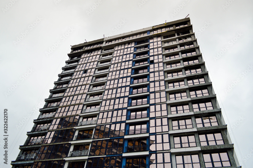 New modern tall blue glass multi-storey comfortable urban monolithic frame houses buildings skyscrapers new buildings in the big city of the megalopolis