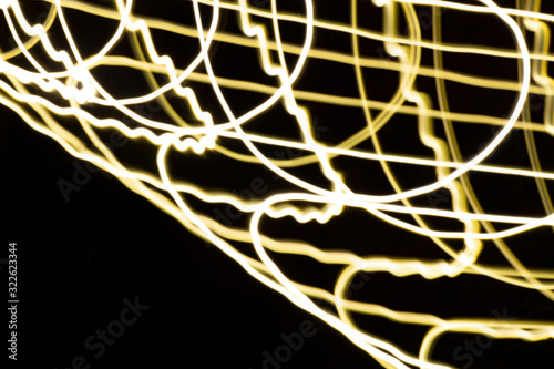 White, gold and yellow color magic light lines. Abstract pattern for light overlays background. Art tool texture based on particles, night party or shutter bulb motion effect in speed.