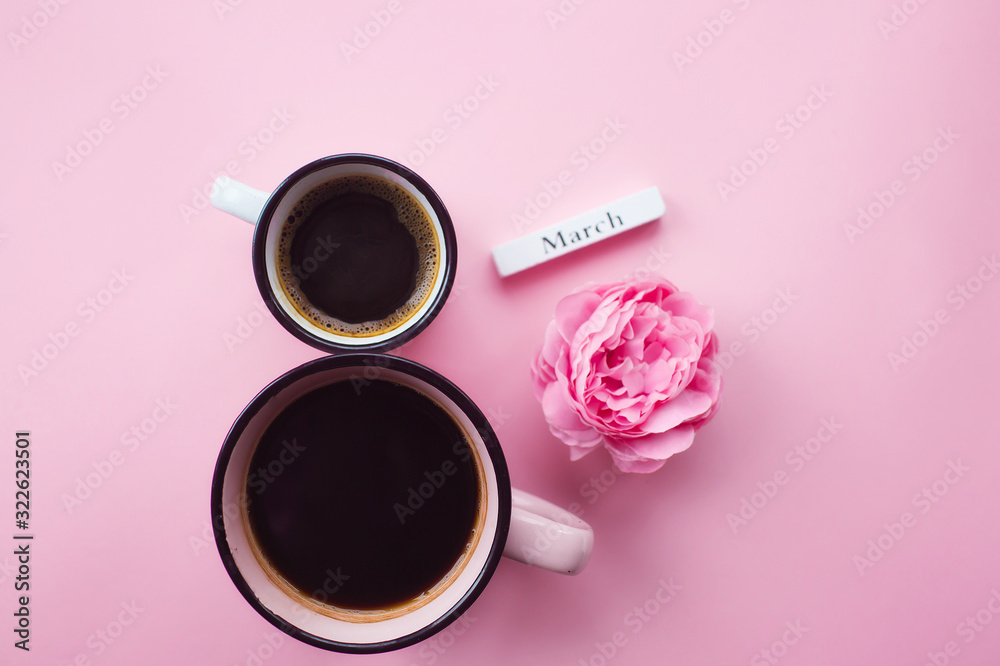 Two cups of coffee, a delicate flower and numbers. Greeting card for Women's Day March 8th. Trendy pink background. March 8 and the concept of "Women's Day". - obrazy, fototapety, plakaty 