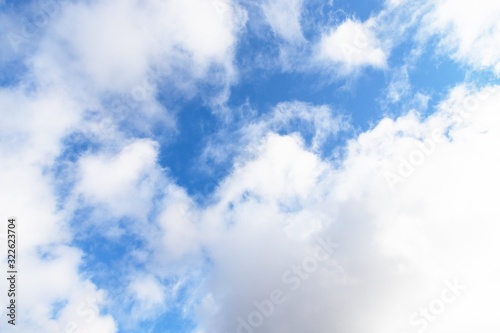 Light blue sky with cirrocumulus clouds. Beautiful sky background © kvitkanastroyu