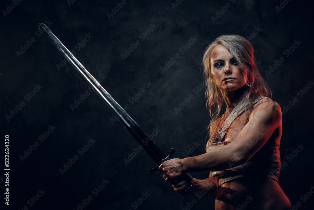 Naked Fantasy woman warrior wearing rag cloth stained with blood and mud in the heat of battle