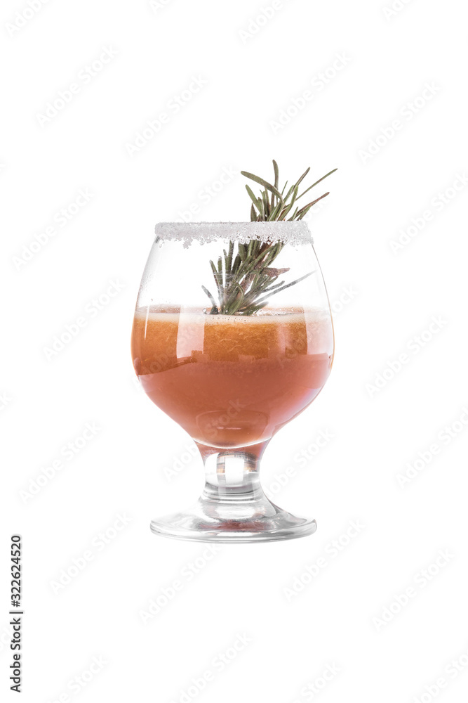 Glass with fresh peach smoothie with rosemary isolated on white background Glass with fresh peach smoothie with rosemary isolated on white background