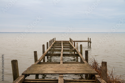 wooden dock with missing planks at lake steinhude in germany