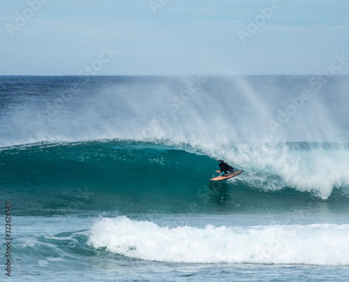 surfing a barrel