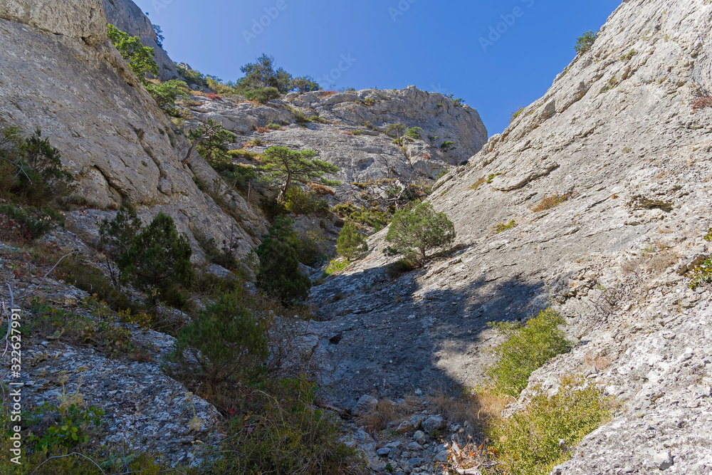 Riverbed pierced in the stone by rain and melt water. Crimean mountains. Riverbed pierced in the stone by rain and melt water. Crimean mountains.