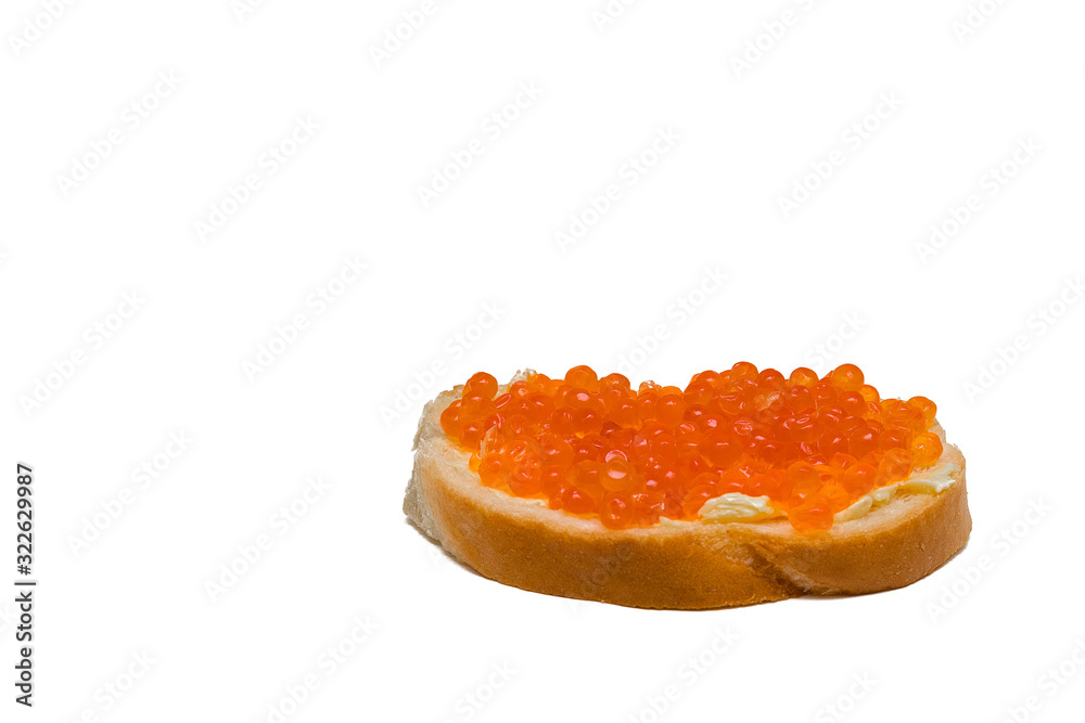 red caviar sandwich. White bread with butter and salmon caviar. On a white background. Isolated. red caviar sandwich. White bread with butter and salmon caviar. On a white background. Isolated.