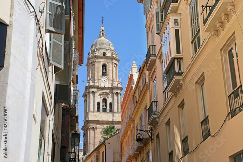 Looking towards the Cathedral through the city narrow streets, in the downtown, Malaga,  Andalusia, Southern Spain. © lisastrachan
