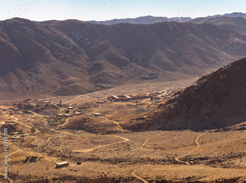 Egypt. Bedouin village. Mount Sinai in the morning in the bright sun. (Mount Horeb, Gabal Musa, Moses Mount). Pilgrimage place and famous touristic destination.