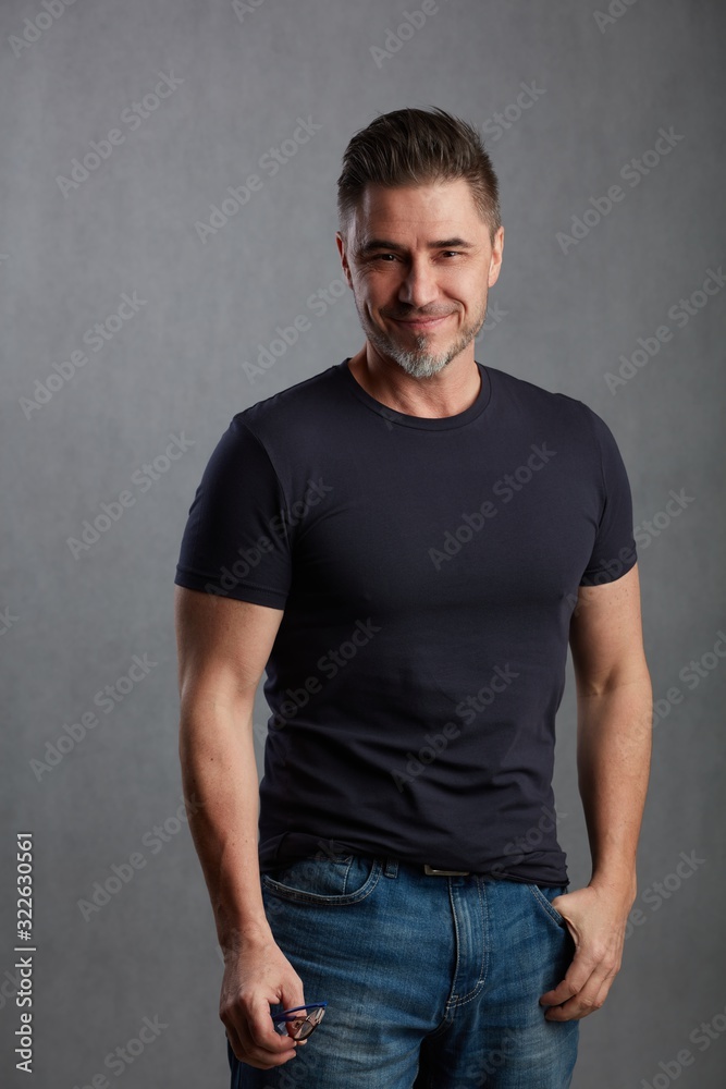 Casual older man against gray background Casual older man against gray background