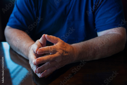 man communicating with hand gestures photo