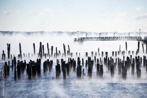 Pilings with deep water dock in seasmoke photo