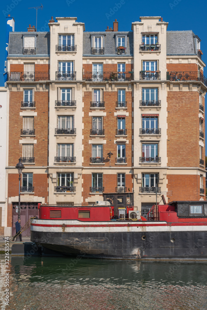 Paris, France - 04 14 2019: Building facade along the Canal de L'Ourcq