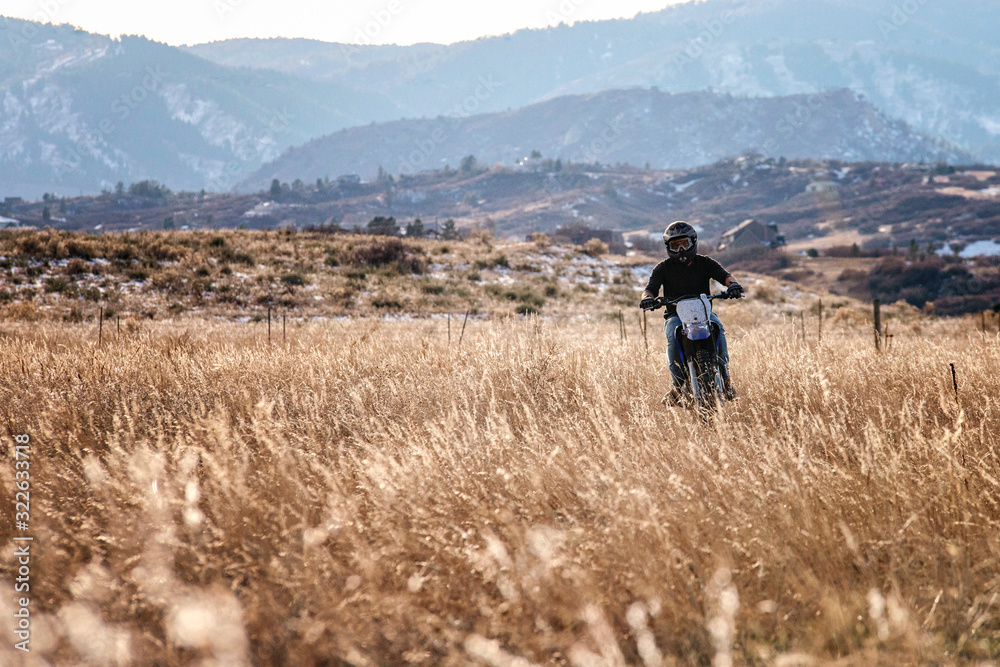 Young Man Dirt Biking in the Foothills in Colorado Young Man Dirt Biking in the Foothills in Colorado
