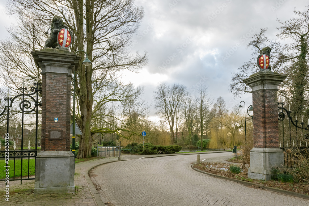 Historic entrance gate with stone lions and shields in the city of Gouda, Netherlands