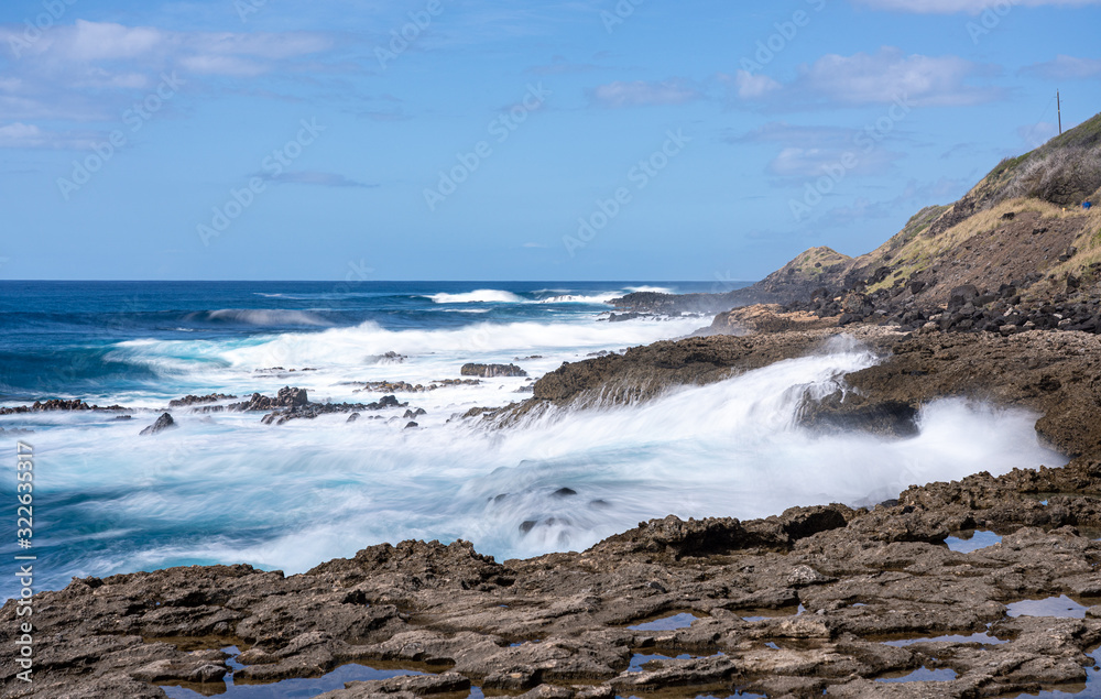 Large waves crash on the shoreline of Ka'ena Point on the extreme west coast of Oahu in Hawaii Large waves crash on the shoreline of Ka'ena Point on the extreme west coast of Oahu in Hawaii