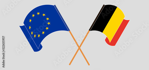 Crossed and waving flags of Belgium and the EU