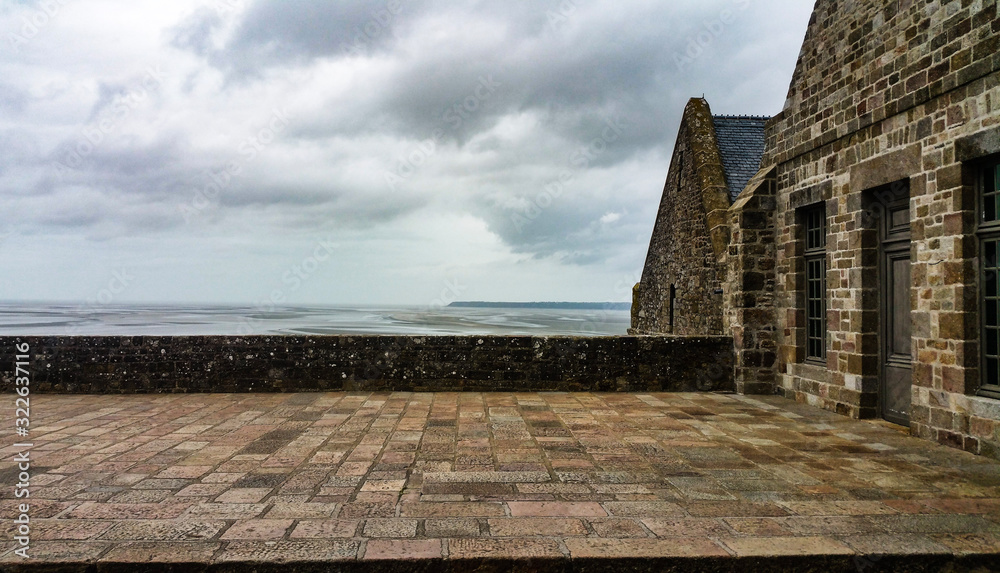 Fototapeta premium view on a low tide from the castle of mont saint michel