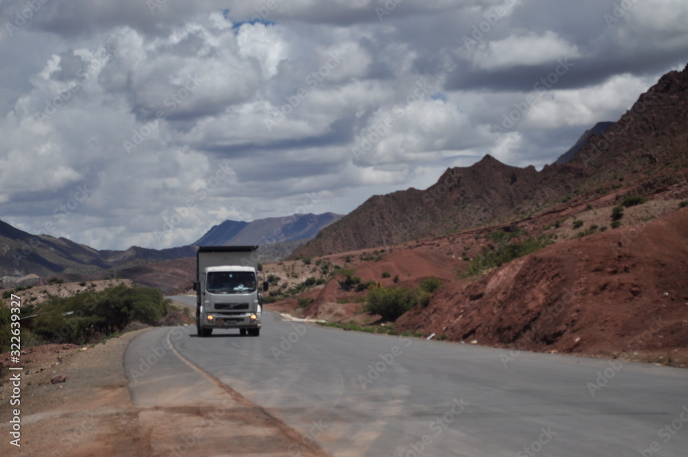 Obraz premium Pickup truck on a road in the Bolivian Andes