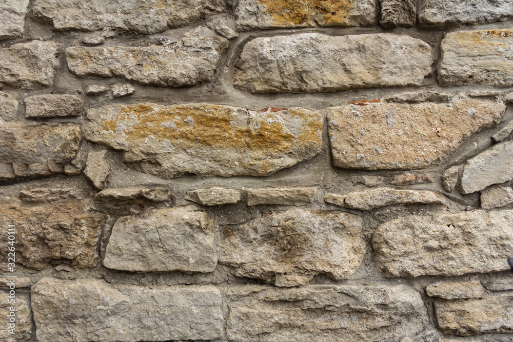Ancient masonry wall. Wall of an ancient castle in the old city. Good stone texture Ancient masonry wall. Wall of an ancient castle in the old city. Good stone texture