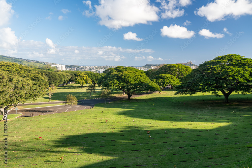 Open grass in the National Memorial Cemetery of the Pacific in punchbowl crater on Oahu, Hawaii