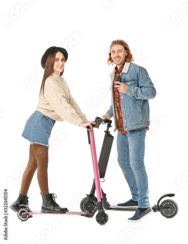 Young couple with kick scoo...