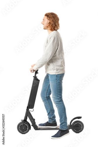 Young man with kick scooter...