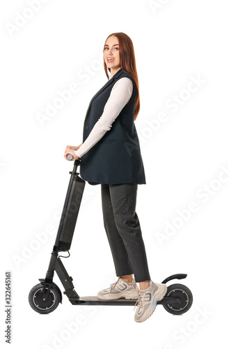 Young woman with kick scoot...