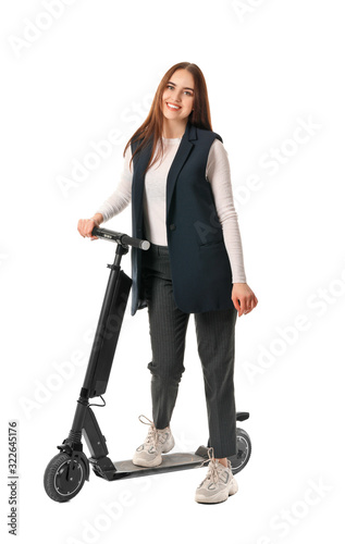 Young woman with kick scoot...