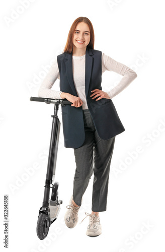 Young woman with kick scoot...