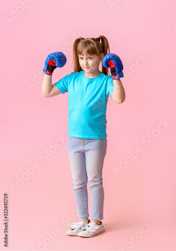 Little girl in boxing glove...