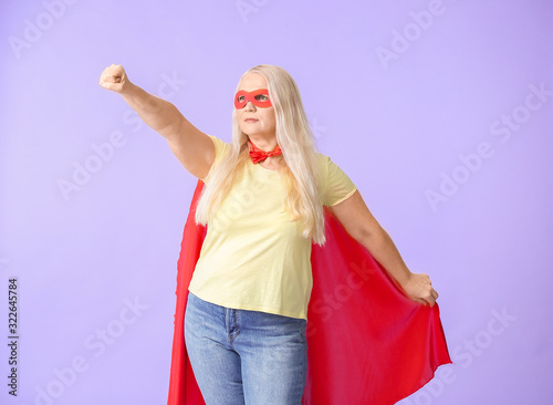 Woman in superhero costume ...