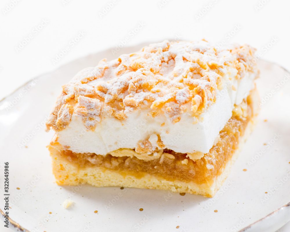 piece of puff cake with white meringue and a layer of apple filling piece of puff cake with white meringue and a layer of apple filling