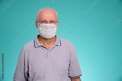 Fotografie Portrait of senior brazilian man using medicine healthcare mask for health medical care, protect Covid-19 and Air pollution pm2