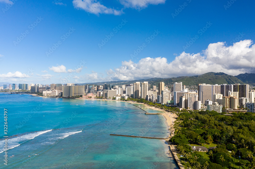 Aerial drone view of the sea front on Waikiki with Honolulu in the background